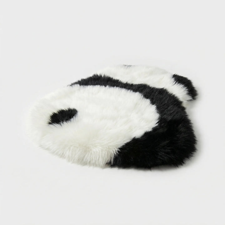 Soft plush panda accent rug with waves, a whimsical decorative floor mat for cozy homes.