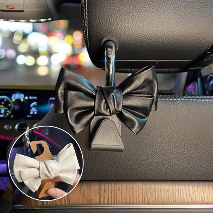 White bowknot car seat back hooks for vehicle organization, elegant plastic accessories