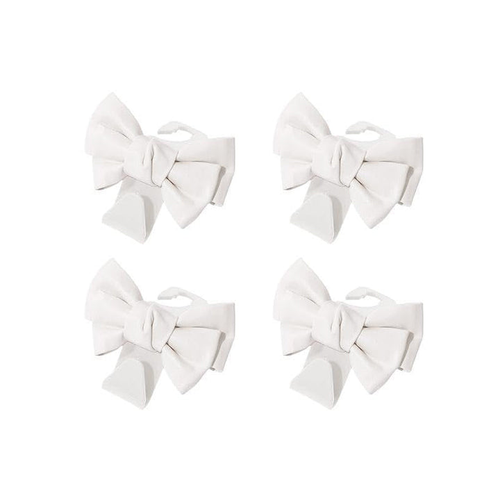 Vehicle organization accessory: white bowknot seat back hooks on a car headrest
