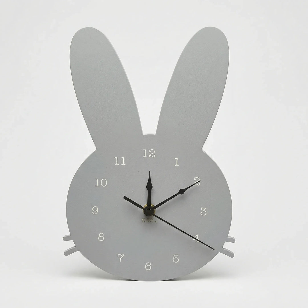 Minimalist white bunny wall clock. Scandinavian design, a silent and decorative accent for modern kids' rooms.