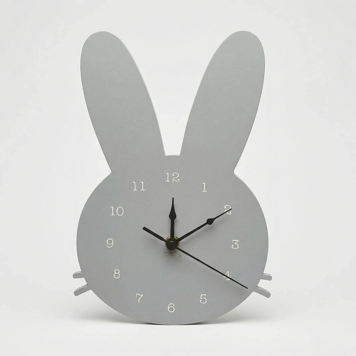 Minimalist white bunny wall clock. Scandinavian design, a silent and decorative accent for modern kids' rooms.