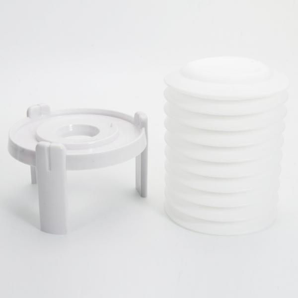 White plastic egg gadget, an effortless peeler for perfectly shelled hard-boiled eggs.