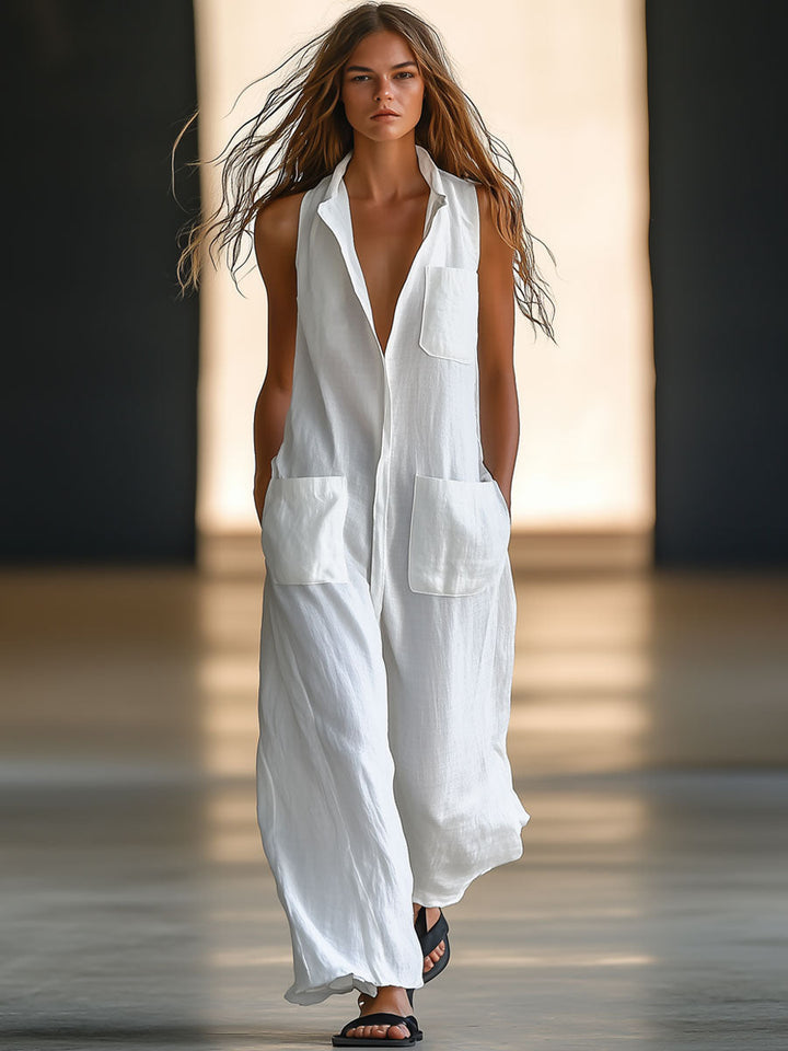 White women's sleeveless jumpsuit with deep V-neck, collar, wide legs, & patch pockets. Perfect for summer resort wear.