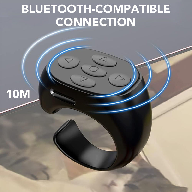 Compact Bluetooth fingertip remote for smartphones, shown controlling music playback, perfect phone accessory.