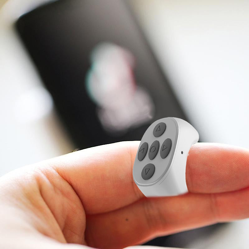 Ergonomic fingertip universal remote for phones, ideal for TikTok, Reels, and YouTube control on smartphones.