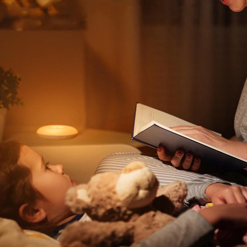 Compact motion sensor LED light, warm glow, magnetic mount, great for bedside tables or wardrobes