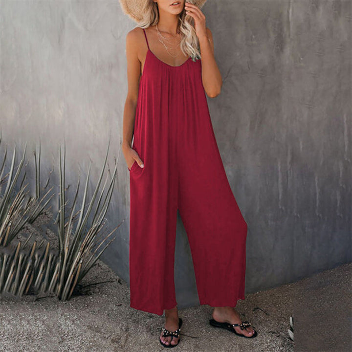 Woman enjoying outdoors in a casual sleeveless wide-leg jumpsuit, epitomizing summer comfort