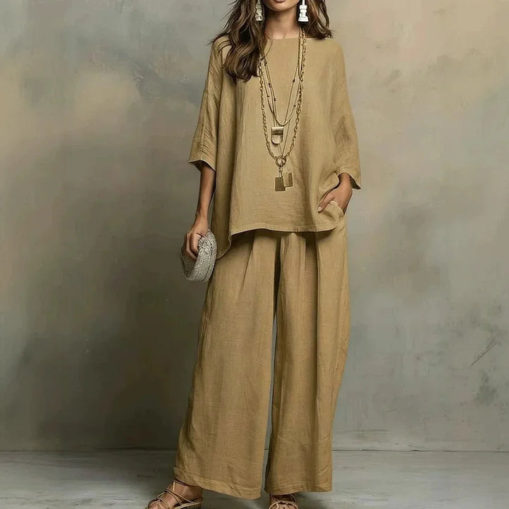 Woman in breathable wide-leg pant set, ideal for summer comfort & relaxed casual wear. Perfect two-piece travel outfit.