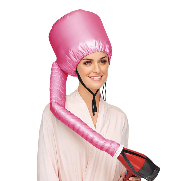 Lifestyle shot of a woman relaxing at home, wearing a pink plopping cap