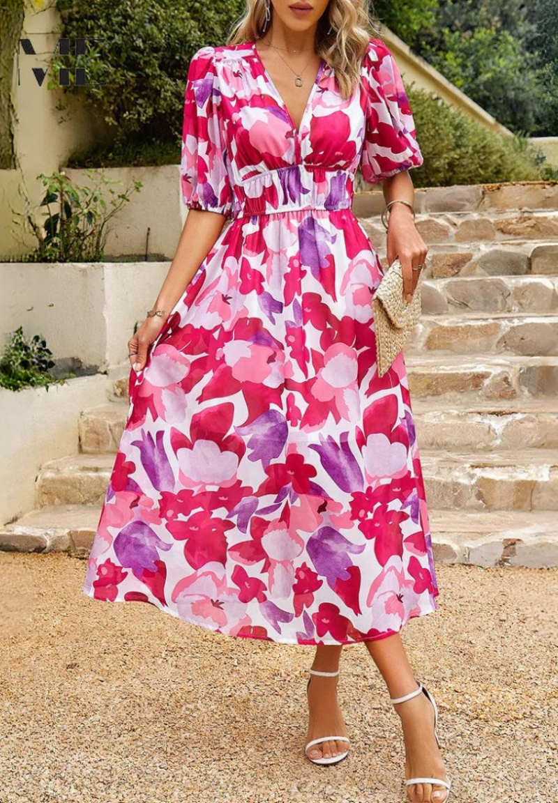 Detail of the abstract pattern and soft fabric of the women's belted midi dress