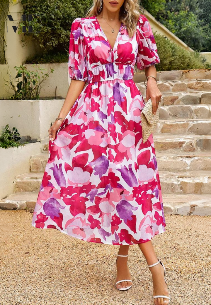 Detail of the abstract pattern and soft fabric of the women's belted midi dress