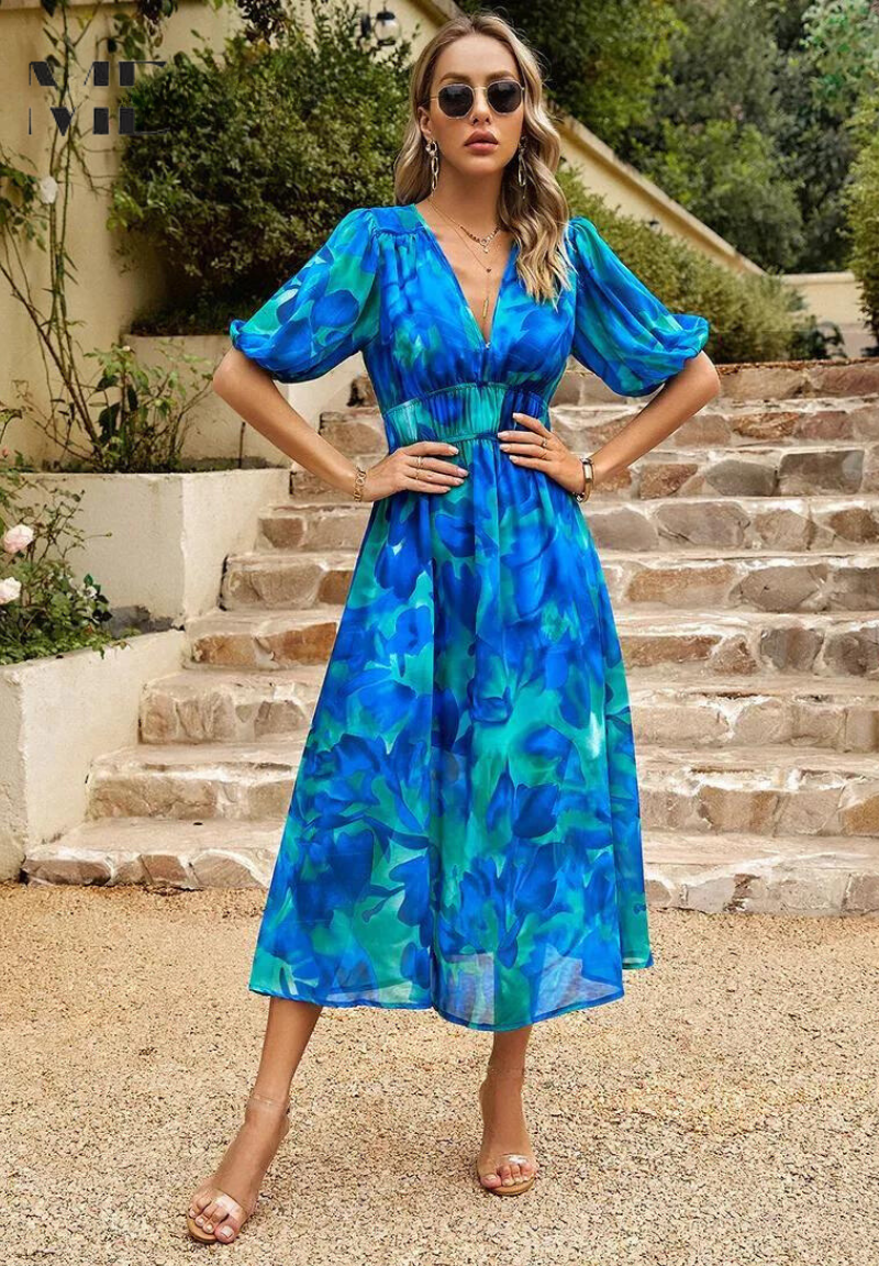 Fashionable women's abstract print midi dress with a self-tie belt, embodying spring style