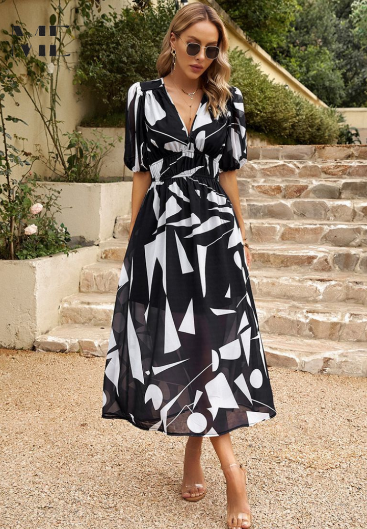 Abstract print and midi length of this women's dress offer elegant, versatile fashion