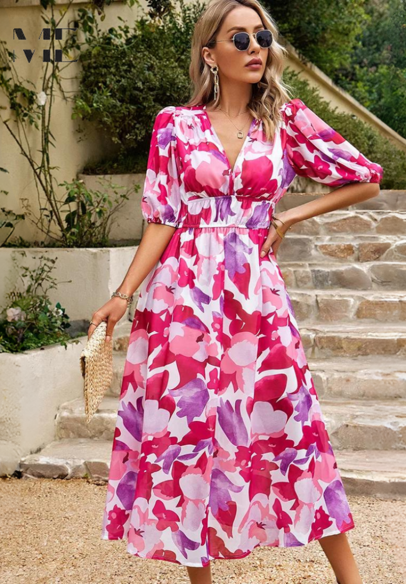 Studio shot of women's abstract print belted midi dress, highlighting vibrant colors