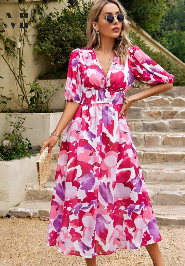 Studio shot of women's abstract print belted midi dress, highlighting vibrant colors