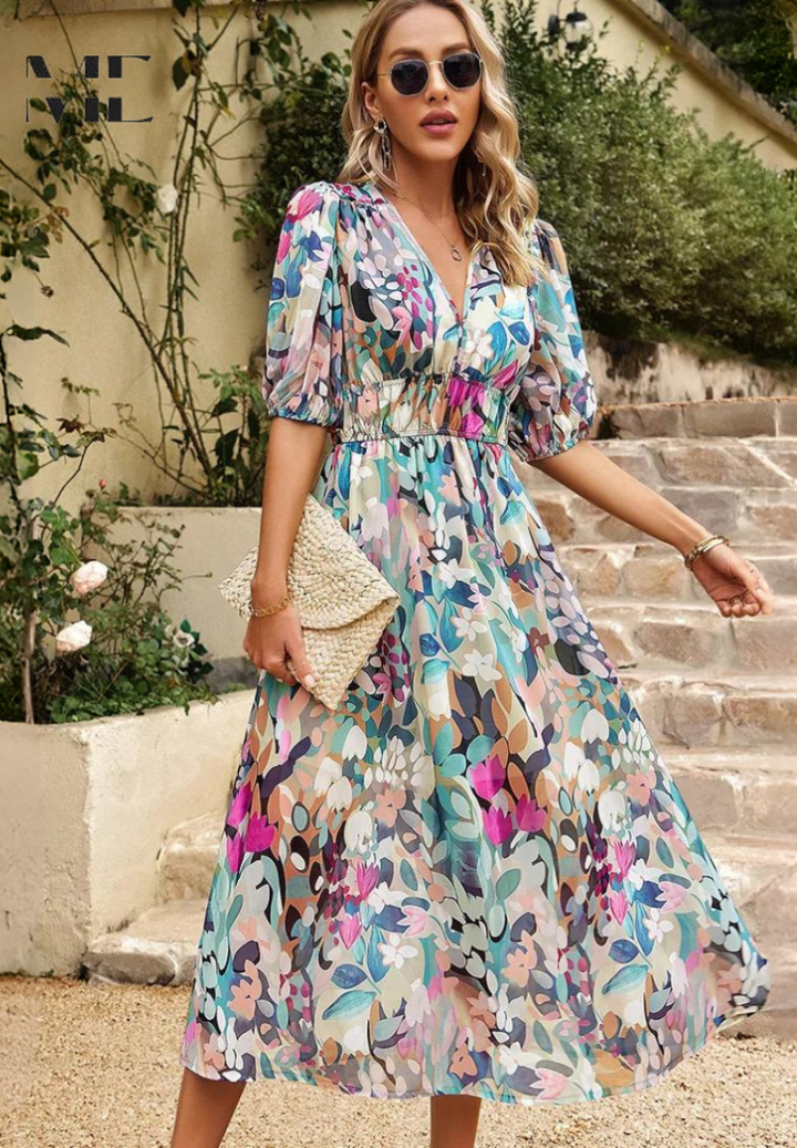 Side view of women's midi dress with abstract print and belt, trendy and elegant