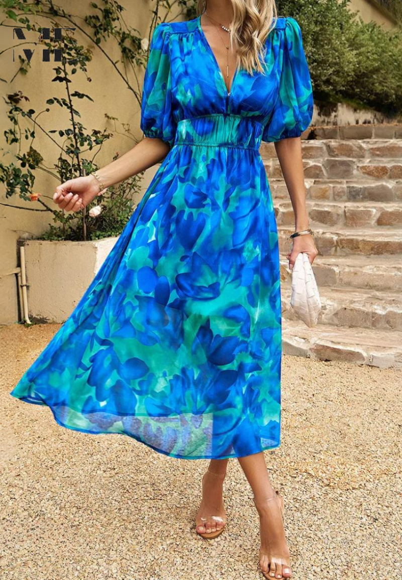 Model posing gracefully in a women's abstract print belted midi dress, stylish appeal