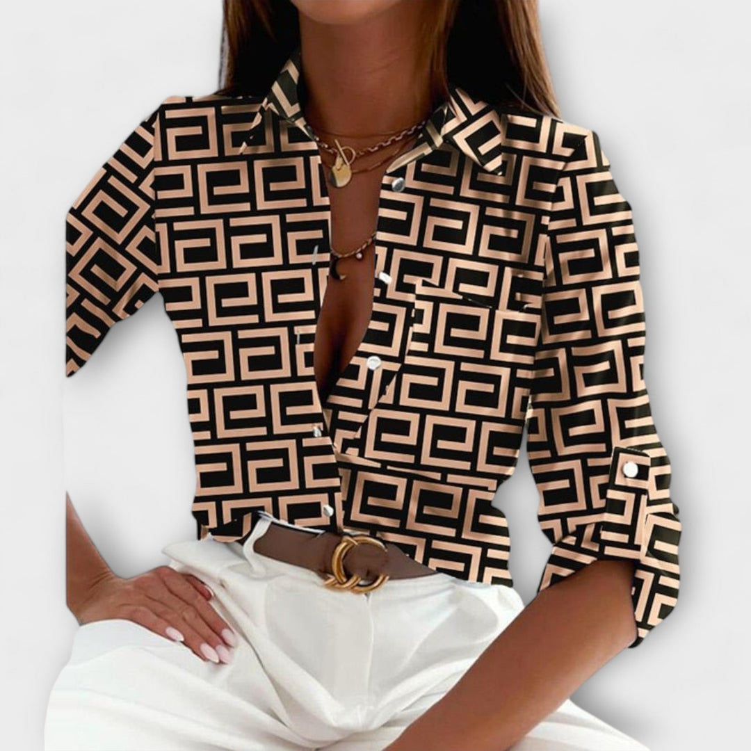 Bold abstract print women's long sleeve button down blouse, a trendy fashion shirt.