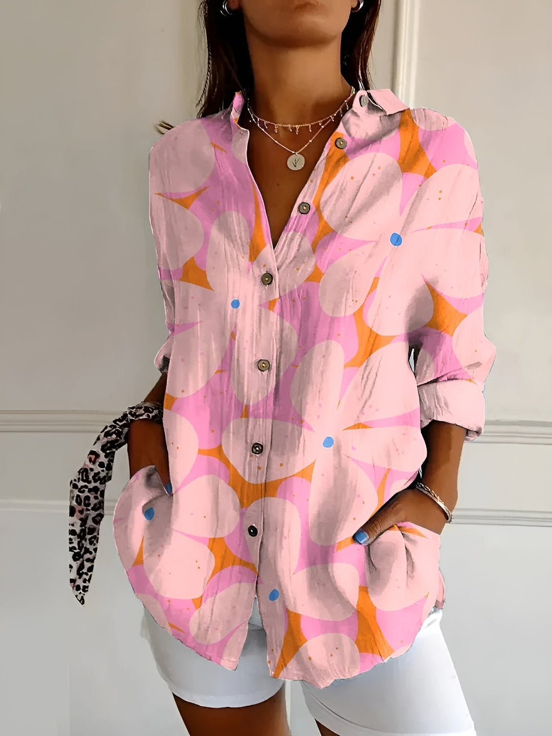 Everyday elegant women's abstract print split-neck blouse. Long sleeve, relaxed fit, easy to style.