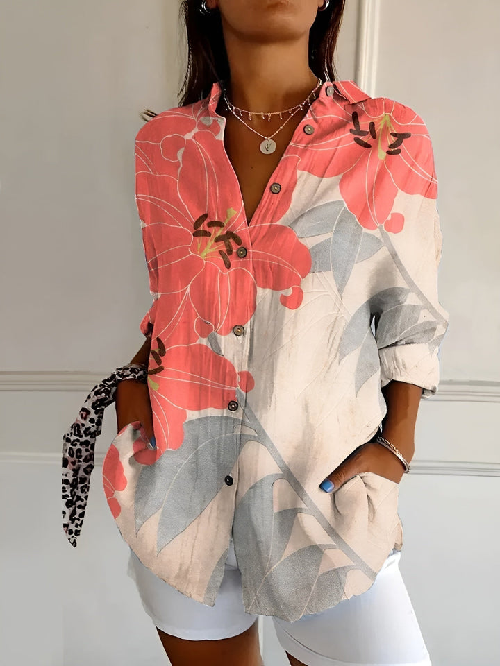 Modern women's abstract print split-neck blouse. Long sleeve, relaxed fit, a fashion-forward versatile top.