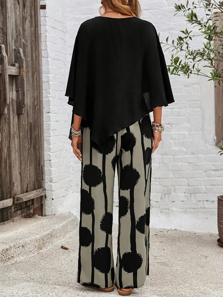 Stylish women's batwing top & wide leg pants set with vibrant abstract print. Perfect for casual comfort.
