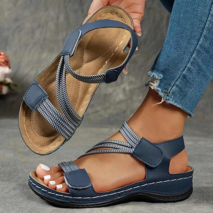 Fully adjustable women's comfort sandals with elastic and hook & loop closure for ideal fit.