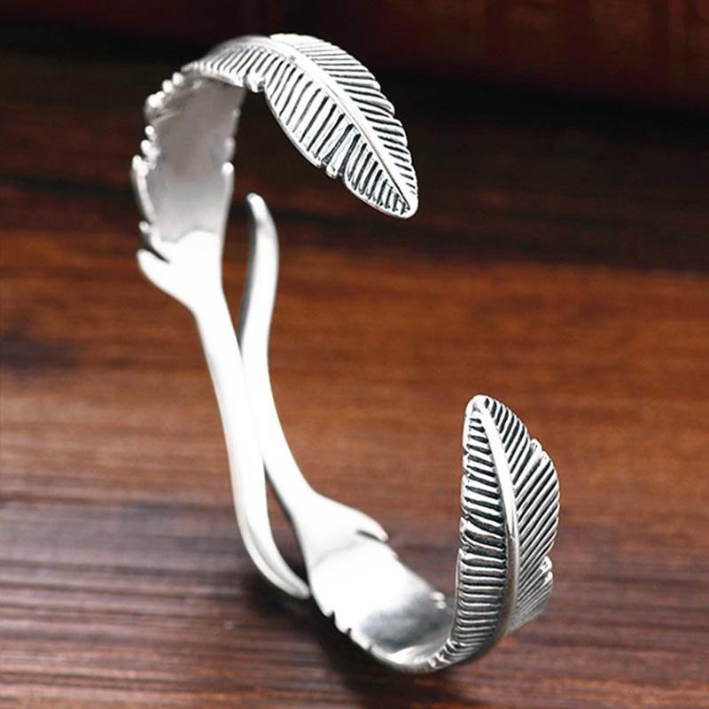 Stylish women's adjustable bracelet with a delicate feather charm, perfect spiritual gift