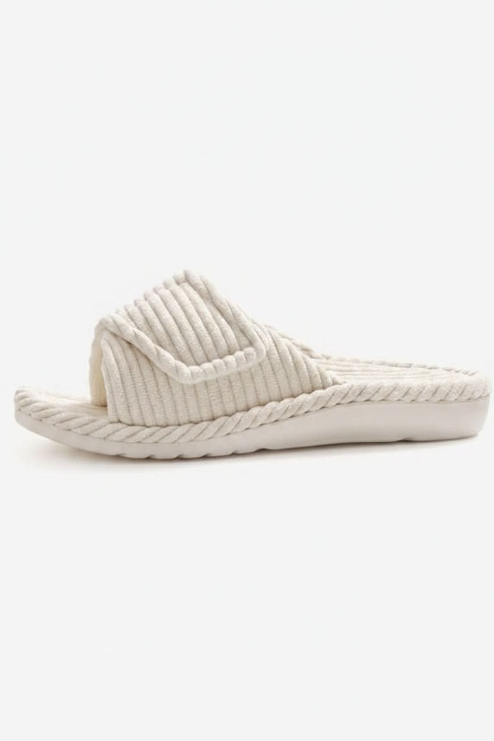 Close-up of the adjustable strap on women's open-toe cushioned slippers.