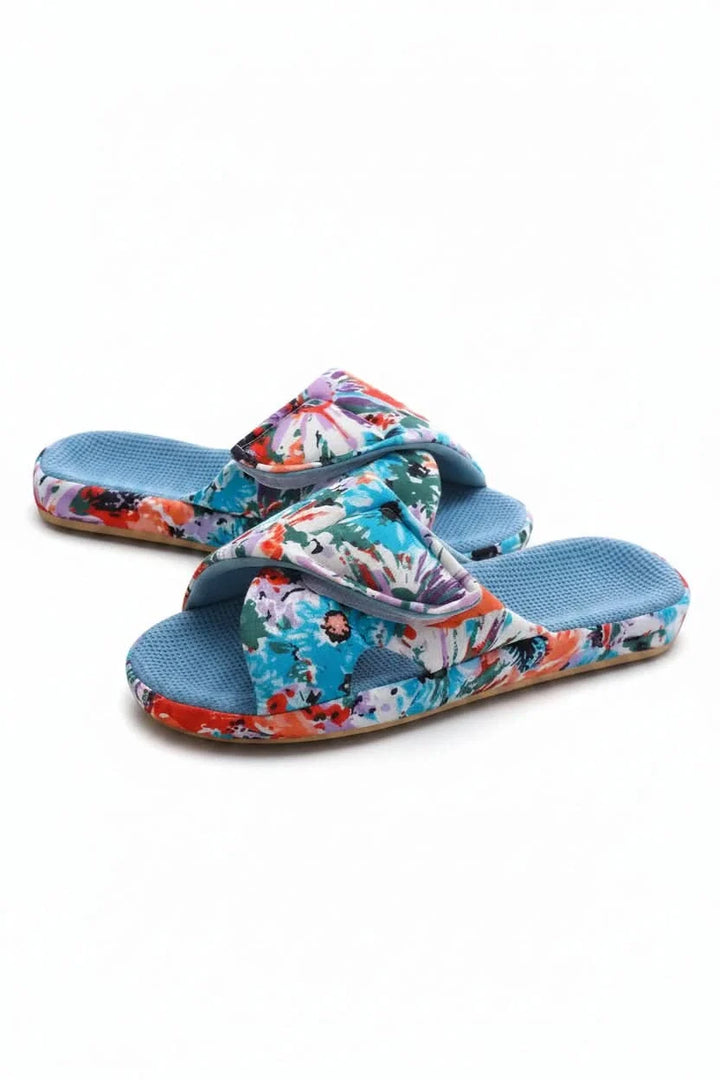 Soft, open-toe women's slippers with adjustable strap for ultimate comfort.