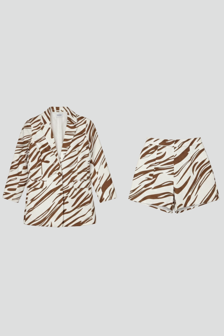 Complete women's animal print matching blazer and shorts co-ord set. Trendy two-piece outfit for summer fashion.