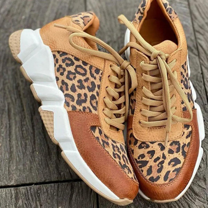 Stylish women's animal print sneakers with laces, perfect for streetwear and everyday comfort