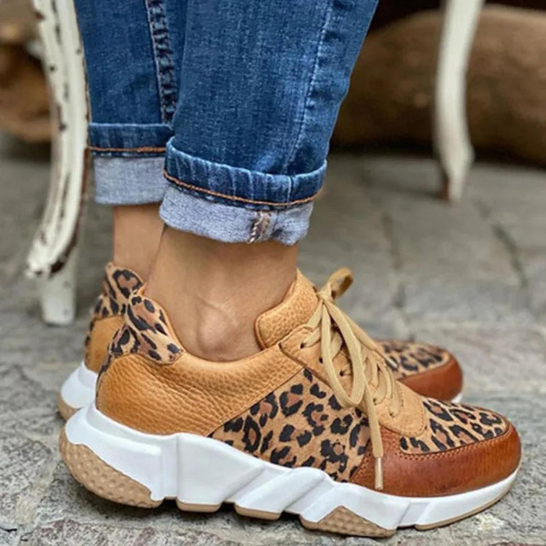 Close-up of women's animal print lace-up running shoes, a trendy choice for athletic fashion