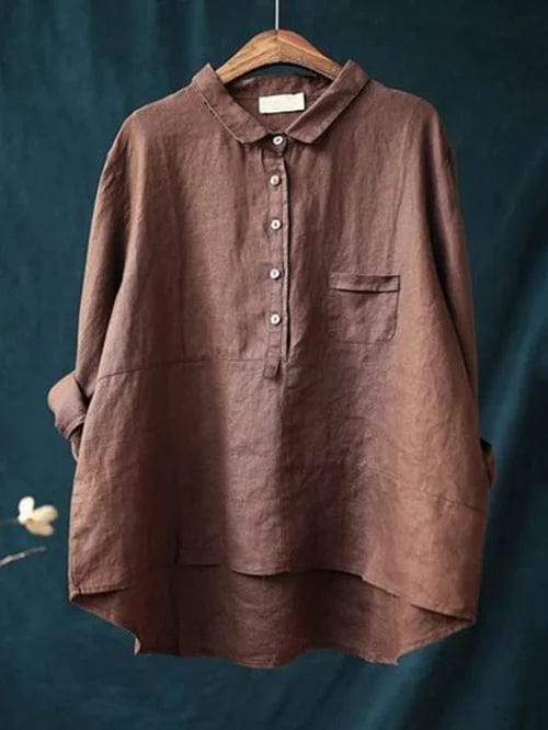 Casual women's long-sleeve button-up blouse, asymmetrical hem for everyday style. Relaxed & versatile top.