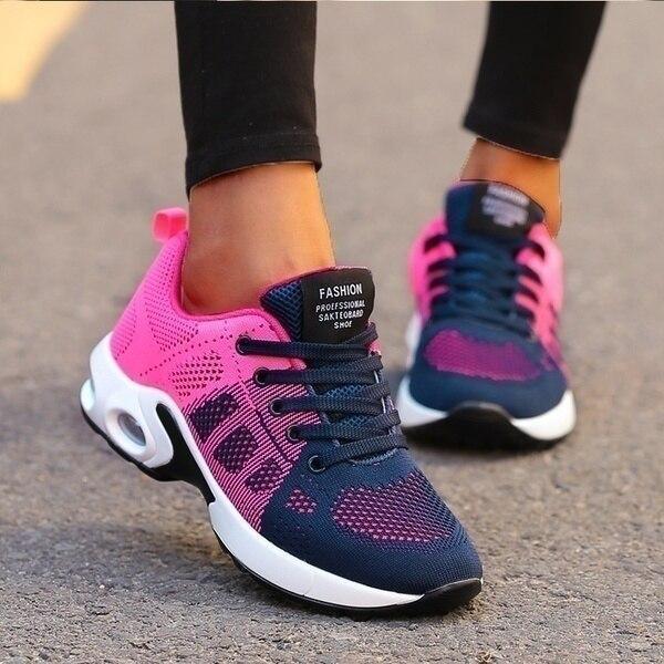 Women's athletic running shoes, light grey with pink accents, comfortable and breathable for sport