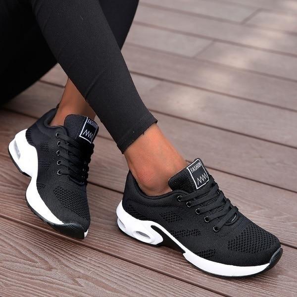 Sporty women's running sneakers in a vibrant blue, designed for performance and casual wear