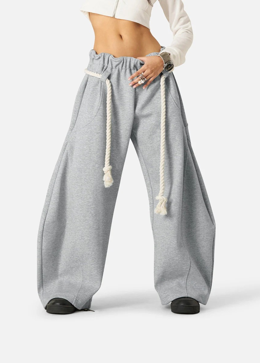 Modern solid color baggy barrel leg sweatpants for women, with wide leg & comfy elastic waist.