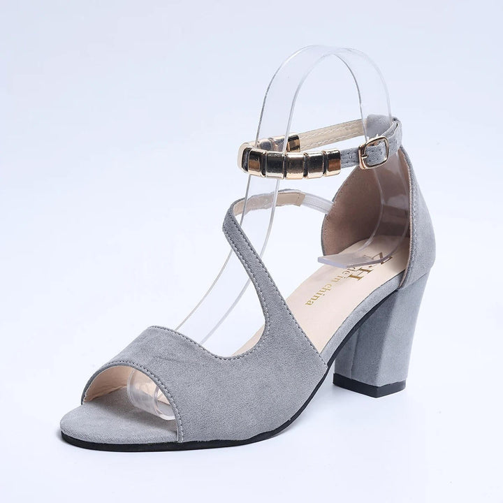 Sophisticated women's beaded block heel sandals with a secure ankle strap for formal events.