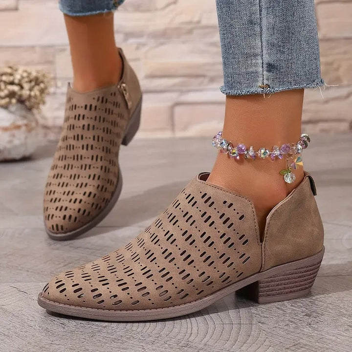 Stylish women's brown ankle boots with strategic cutouts, offering a breezy feel for casual summer footwear