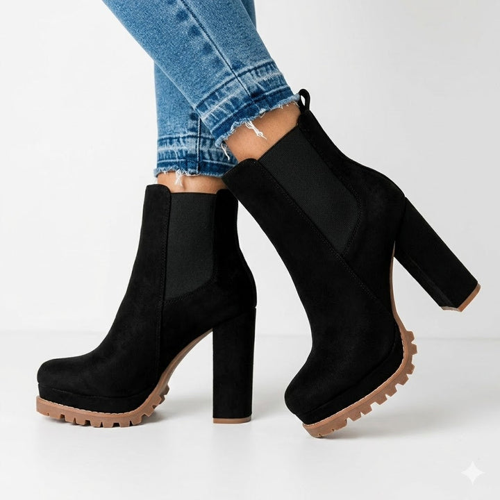 Women's black ankle boots with platform sole & sturdy block heel. Perfect for chic everyday style.