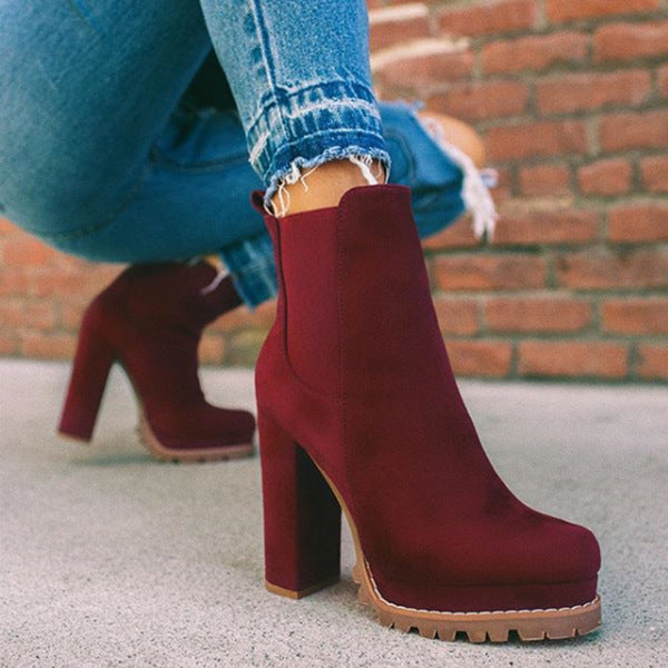 Chic women's slip-on ankle boots. Features platform sole & block heel, versatile for casual or evening wear.