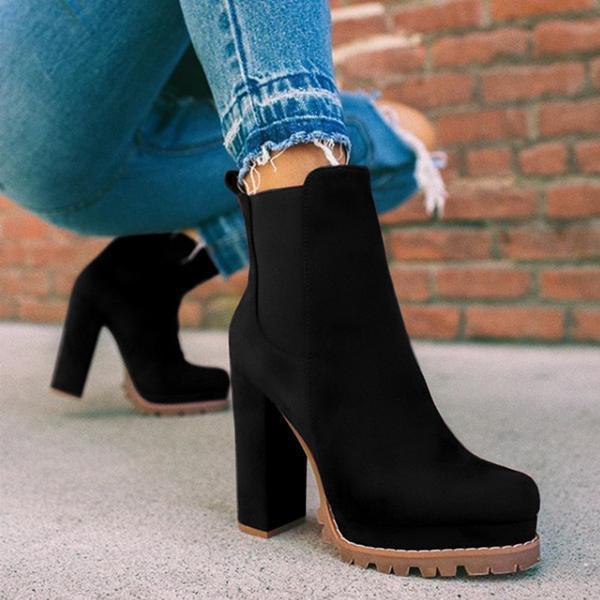 Versatile women's footwear: Ankle boots featuring a stylish platform sole and a solid block heel. Slip-on design.