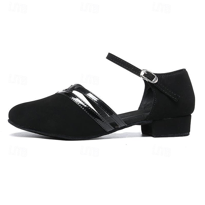 Stylish women's black ankle strap dance shoes, versatile for studio performance or elegant everyday wear. Secure fit.