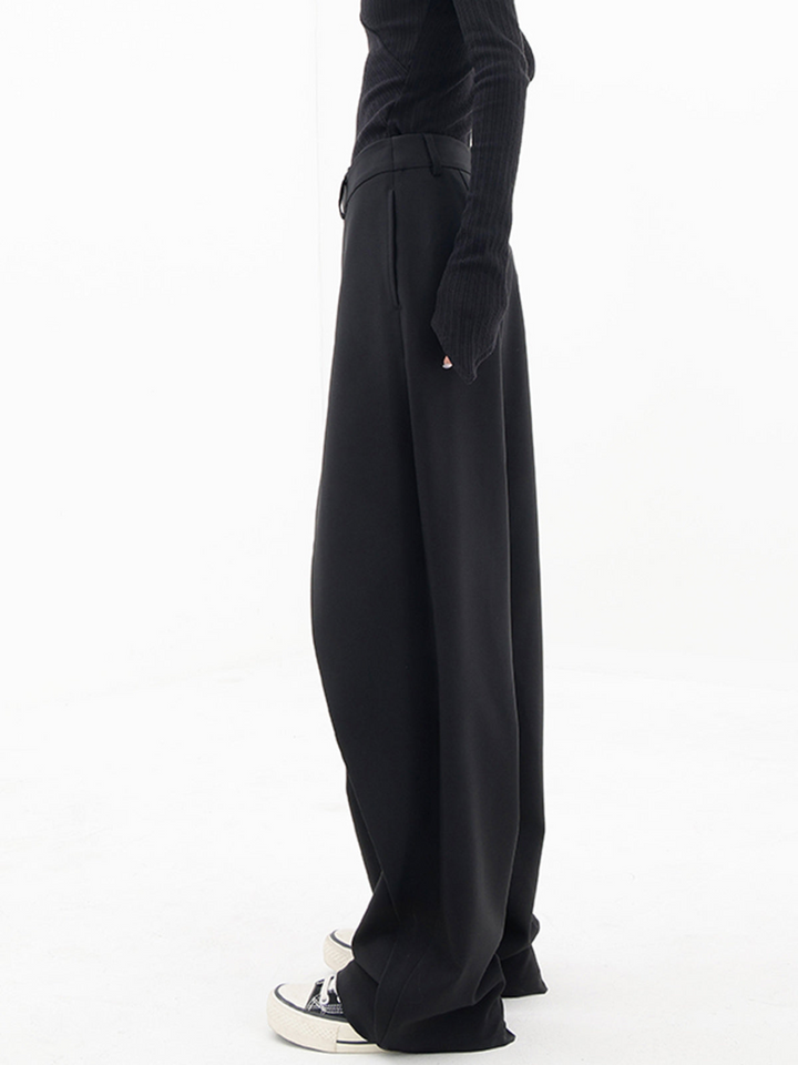 Fashionable women's asymmetric baggy trousers, offering comfort & a relaxed, chic style.