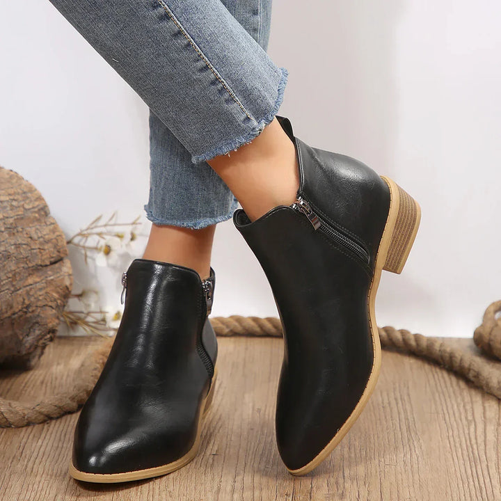 Pair of women's brown casual ankle boots, side zip design for easy wear, great for everyday fashion