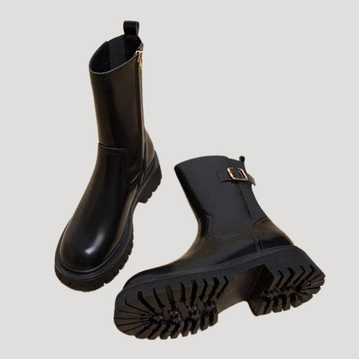Stylish women's black chunky mid-calf boots, a must-have for spring footwear collections.