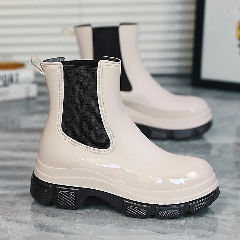 Stylish women's Chelsea rain boots with chunky platform sole. Waterproof for wet weather, comfortable fashion footwear.