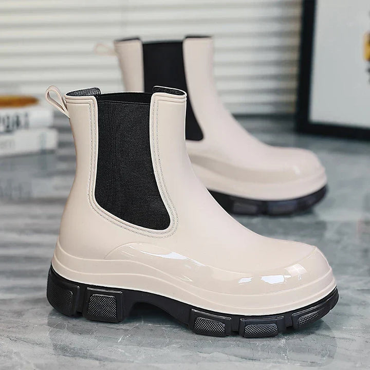 Stylish women's Chelsea rain boots with chunky platform sole. Waterproof for wet weather, comfortable fashion footwear.