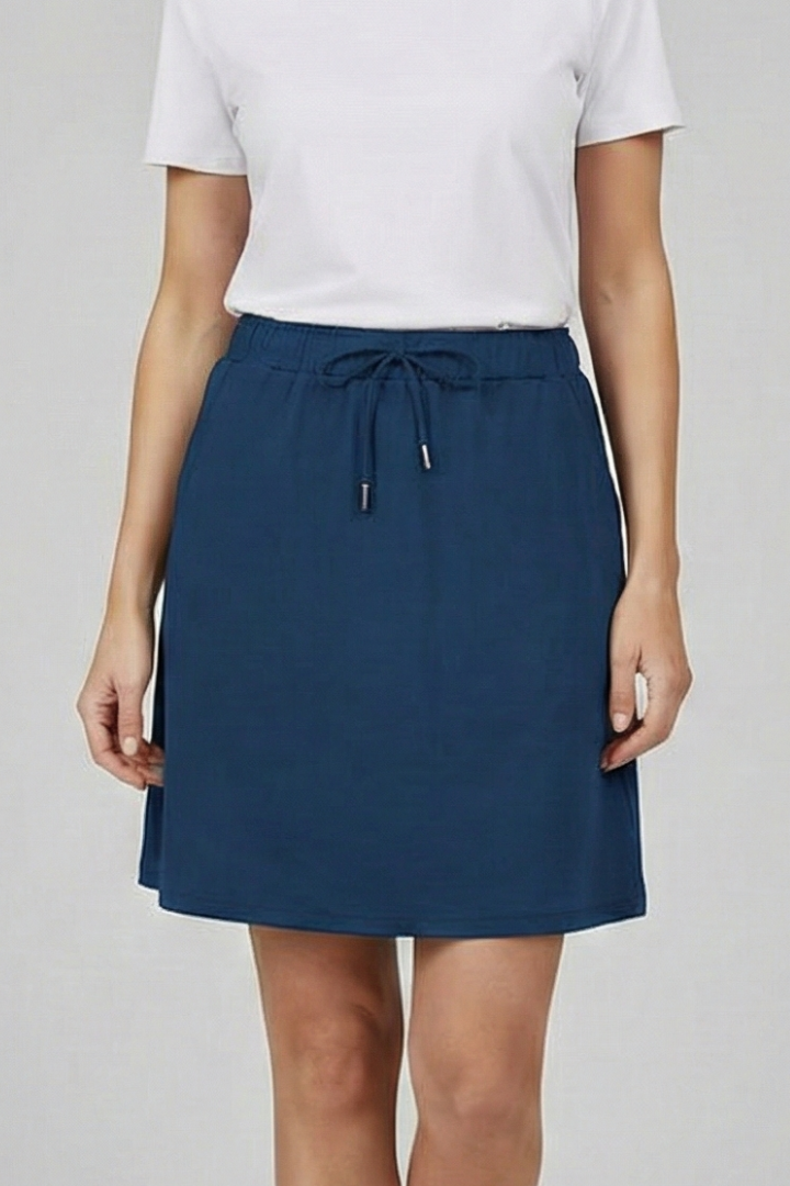 Close-up on fabric of women's comfortable drawstring skort, ideal for summer & active wear.