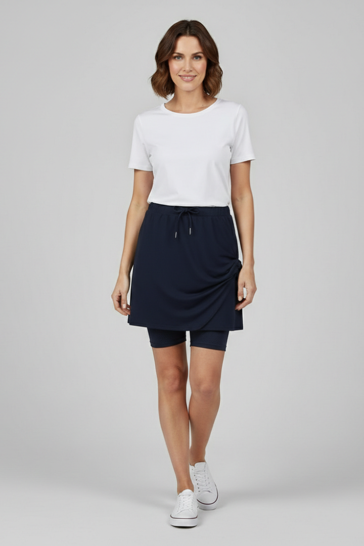 Stylish women's mid-rise straight skirt featuring a comfy drawstring waist & hidden shorts.