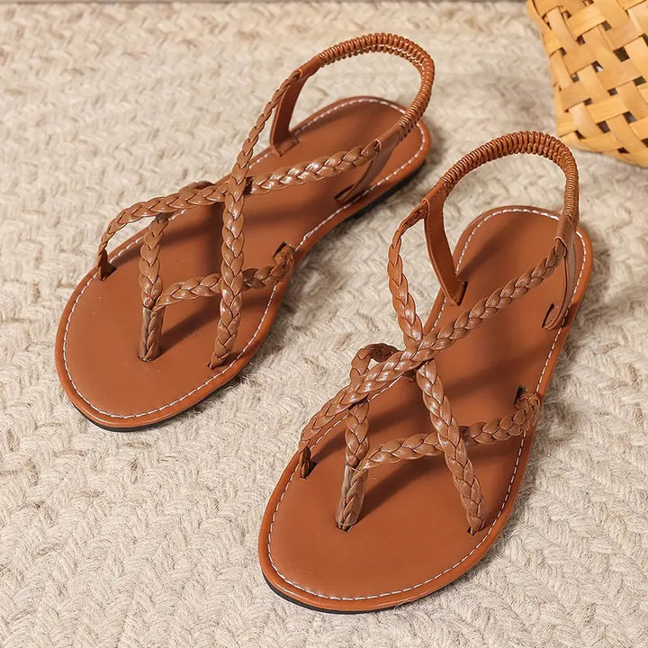 Stylish ladies' flat sandals, open-toe design, elastic strap for everyday versatility.